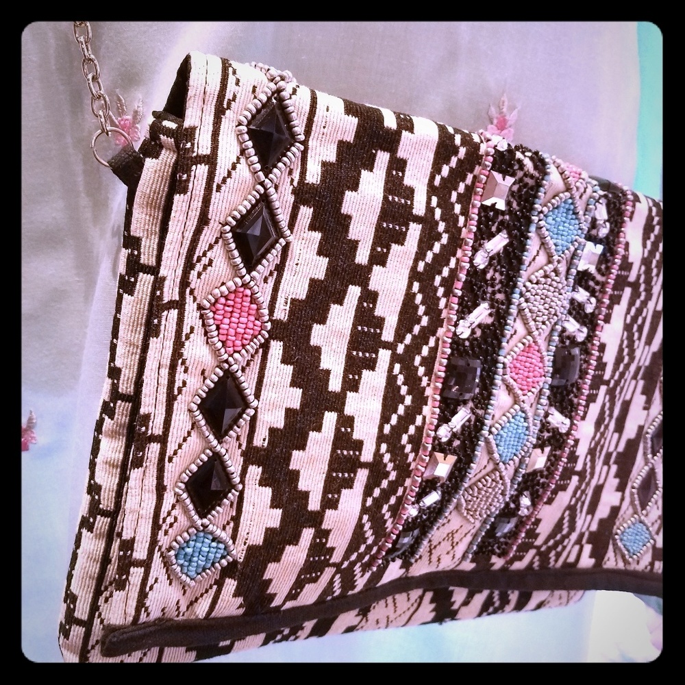 Handbeaded messenger. Works great for your technol